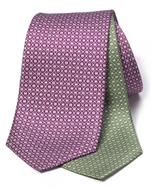 A delicate geometric pattern in luxurious silk adorns this handsome tie from Salvatore Ferragamo. A delicate geometric pattern in luxurious silk adorns this handsome tie from Salvatore Ferragamo.