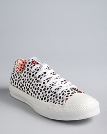 Spot on: these classic Converse All Star Sneakers take on fashion flair in a fun polka dot print. Mix and match the red and white laces, depending on your mood.