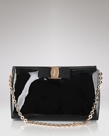 A signature grosgrain bow lends polished sophistication to Salvatore Ferragamo's glossy patent leather mini bag. A signature grosgrain bow lends polished sophistication to Salvatore Ferragamo's glossy patent leather mini bag.