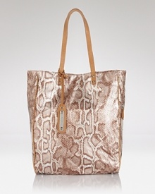 Opt for an exotic take on practical style with this embossed tote from Sam Edelman. Perfectly sized for on-the-go poise, it's the only bag you'll need for busy days on the go. Opt for an exotic take on practical style with this embossed tote from Sam Edelman. Perfectly sized for on-the-go poise, it's the only bag you'll need for busy days on the go.
