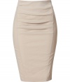 The ultimate pencil skirt, this flattering Donna Karan favorite will keep you turning heads while maintaining comfort - Pencil silhouette, front draped pleating, seaming details, back slit, concealed back zip closure - Pair with a silk blouse, fishnets, and platform pumps