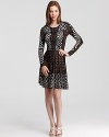 An abstract, geometric print lends a modern feel to this BCBGMAXAZRIA sweater dress--a flared skirt gives a girlish look.