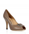 Inject classic style into your look with these ultra elegant pumps from Salvatore Ferragamo  - Peep-toe, moderate heel, front textured logo detail at toe - Pair with cropped trousers or a ladylike cocktail-ready frock