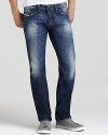 Diesel's Safado jeans cut a clean silhouette with a slim fit and straight leg. Distressing and fading add worn-in edge.