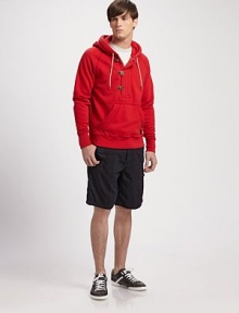 This boldly-hued pullover hoodie is all about casual comfort with hook and zipper closures and finished with logo detail.Drawstring hoodHalf-zip frontKangaroo pocketsRibbed cuffs and hemCotton/polyesterHand washImported