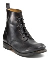 A refined military-style boot outfited with a smooth burnished leather toe, leather linings and a pull tab at the back.