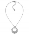 Elegance comes full circle. Carolee's glitzy circle pendant is decorated with glass crystals set in imitation rhodium-plated mixed metal. Approximate length: 16 inches +2-inch extender. Approximate drop: 1-1/4 inches.