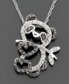A sweet and sparkling style: this adorable panda diamond pendant features round-cut black and white diamonds (1/5 ct. t.w.) set in 14k white gold. Diamond necklace drop measures 3/4 inch; chain measures 16 inches.
