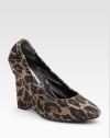 Leopard-print fabric wedge silhouette adds a touch of exotic to any ensemble. Self-covered wedge, 4 (100mm) Covered platform, ½ (15mm) Compares to a 3½ heel (90mm) Fabric upper Leather lining Buffed leather sole Padded insole ImportedOUR FIT MODEL RECOMMENDS ordering one half size up as this style runs small. 