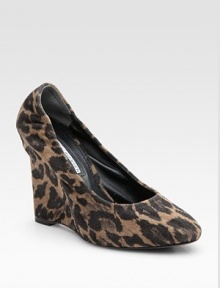 Leopard-print fabric wedge silhouette adds a touch of exotic to any ensemble. Self-covered wedge, 4 (100mm) Covered platform, ½ (15mm) Compares to a 3½ heel (90mm) Fabric upper Leather lining Buffed leather sole Padded insole ImportedOUR FIT MODEL RECOMMENDS ordering one half size up as this style runs small. 