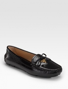 Patent leather with bow and golden logo hardware.Rounded toe Leather lining Padded insole Rubber sole Made in ItalyOUR FIT MODEL RECOMMENDS ordering true size. Patent leather with bow and golden logo hardware.Rounded toe Leather lining Padded insole Rubber sole Made in ItalyOUR FIT MODEL RECOMMENDS ordering true size.