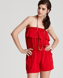 A ruffled neckline puts a flirtatious spin on Shoshanna's strapless romper. In a romantic hue, this low-fuss piece hints at your inner beach bombshell.