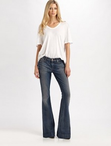 Curve-hugging flares with a low-rise waist in subtly sanded stretch denim.THE FITFitted through hips and thighsRise, about 8Inseam, about 35THE DETAILSZip flyFive-pocket style98% cotton/2% spandexMachine washMade in USA of imported fabricModel shown is 5'9 (175cm) wearing US size 4. Curve-hugging flares with a low-rise waist in subtly sanded stretch denim.THE FITFitted through hips and thighsRise, about 8Inseam, about 35THE DETAILSZip flyFive-pocket style98% cotton/2% spandexMachine washMade in USA of imported fabricModel shown is 5'9 (175cm) wearing US size 4.