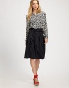 A sexy wrapped waist gives this simple cotton skirt a glamorous touch.Wrapped waistbandFull, gathered skirtConcealed back zip closureAbout 26 from waist to hemCottonDry cleanImported