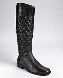 Classically quilted, the luxe leather Rainer boots from VINCE CAMUTO offer timeless style. A full zip closure allows for easy on and off.