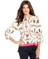 A bright status print enlivens this fashion-forward top from Ellen Tracy. Pair it with crisp pants to complete the look!