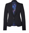 A structured blazer adds a touch of tailored chic to any wardrobe, and this black jacket from Paul Smith easily toes the line between masculine cool and feminine polish - Slim, fitted cut tapers through waist - Small collar and medium width lapels - Elegant, single button closure and two flap pockets - Vent at rear - Lush, floral print lining in rich shades of violet and blue - Seamlessly transitions from work to evening cocktails, parties and dinners - Pair with leather pants or pencil skirts, skinny dark denim or suit trousers