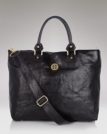 Get go-anywhere style with this sleek leather tote with logo plaque from Tory Burch. Get go-anywhere style with this sleek leather tote with logo plaque from Tory Burch.