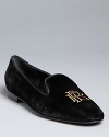 Ralph Lauren Collection crafts this season's must-have smoking flats in luxurious velvet with golden logo embroidery.