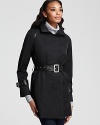 This essential Elie Tahari trench flaunts a sleek leather belt and buckle cuffs for a sophisticated finish.