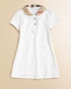 This sweet knit dress is embellished with a pleated check collar and placket. Epaulettes Peter Pan collar Short sleeves Two button placket front Front left patch pocket A-line skirt Cotton/elastane Machine wash Imported Please note: Number of buttons/snaps may vary depending on size ordered. 