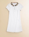 This sweet knit dress is embellished with a pleated check collar and placket. Epaulettes Peter Pan collar Short sleeves Two button placket front Front left patch pocket A-line skirt Cotton/elastene Machine wash Imported Please note: Number of buttons/snaps may vary depending on size ordered. 