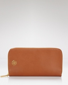 With space for all the everyday essentials, Tory Burch's brown leather zip-around wallet is indispensably chic. With space for all the everyday essentials, Tory Burch's brown leather zip-around wallet is indispensably chic.