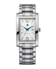 Even classics can use a modern punch. This handsome Tommy Hilfiger watch catches eyes with unexpected blue accents. Silvertone mixed metal bracelet and rectangular case. Textured dial features silvertone stick indices, numerals at twelve and six o'clock, date window at three o'clock, iconic flag logo and bright blue hands. Quartz movement. Water resistant to 30 meters. Ten-year limited warranty.