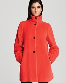 In vibrant flame, Armani's wool and cashmere blend coat lends a soft hand with a bold look. With timeless quality and forward style, this coat doesn't disappoint.