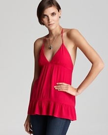This Patterson J. Kincaid halter top, complete with ruffled hem, is an effortless way to add color and femininity to your warm-weather wardrobe. This Patterson J. Kincaid halter top, complete with ruffled hem, is an effortless way to add color and femininity to your warm-weather wardrobe.