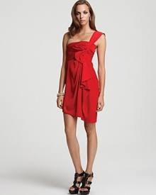 Stand out in a sea of black dresses in this vibrant cocktail frock from BCBGMAXAZRIA. The single crossbody strap travels across the bust, with gathering at the waist and a cascading front ruffle.