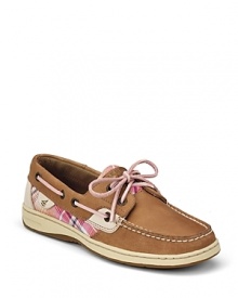 A signature boat shoe from Sperry Top-Sider, touting pink plaid accents.