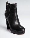 KORS Michael Kors manages to keep a basic black bootie fresh with an updated almond toe, stitched platform and sleek, pull-on silhouette. They will be a workday and weekend staple.