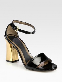 A sculpted goldtone heel characterizes this daring patent leather silhouette. Goldtone heel, 2 (50mm)Patent leather upperAdjustable ankle strapLeather lining and solePadded insoleMade in Italy