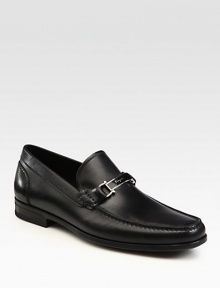 Signature hardware distinguishes these sleek leather slip-ons, crafted in Italy.Leather liningPadded insoleRubber soleMade in Italy Signature hardware distinguishes these sleek leather slip-ons, crafted in Italy.Leather liningPadded insoleRubber soleMade in Italy