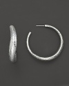 Subtly textured sterling silver hoops in an undulating silhouette. By Ippolita.