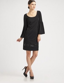 Sparkling Swarovski crystals skirt the hem of this bell-sleeved silhouette.Scoopneck Long bell sleeves Swarovski crystal details at hemline Concealed back zip Fully lined About 22 from natural waist Polyester Dry clean Made in USA of imported fabricModel shown is 5'9 wearing US size 2. Sparkling Swarovski crystals skirt the hem of this bell-sleeved silhouette.Scoopneck Long bell sleeves Swarovski crystal details at hemline Concealed back zip Fully lined About 22 from natural waist Polyester Dry clean Made in USA of imported fabricModel shown is 5'9 wearing US size 2.