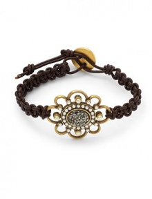 THE LOOKClassic collectionFlower detailBlack Swarovski crystal and glass pearl accentsRhodium-plated settingBraided leatherToggle closure with gold-plated claspTHE MEASUREMENTAccent width, about 1.25Length, about 8.5ORIGINMade in USA