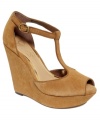 Completely cute. Jessica Simpson's Shama platform wedge sandals feature a smooth suede upper and a darling t-strap that's sure to make you smile.