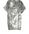 Bold printed tunic top in wool and silk brings style to casual, Downtown looks - Features black and white leopard print with drama close-up - Long loose fit with short, wide sleeves and crew neckline - Pair with skinny jeans, leggings or leather pants and heels