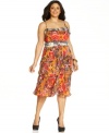 A vibrant print and flattering tiered silhouette makes this Nine West plus size dress an incomparable pick for the seasonal celebrations ahead!