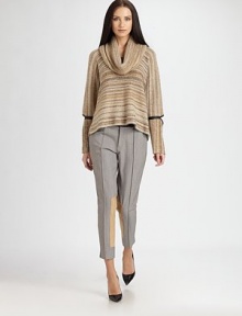 This slouchy, softly-knit style is accented by uniquely vented, leather-trimmed sleeve details.Cowl turtleneckLong sleevesLeather-trimmed elbow vents68% acrylic/32% woolDry cleanMade in USA of Italian fabricModel shown is 5'11 (180cm) wearing US size Small. Additional Information Women's Premier Designer & Contemporary Size Guide 