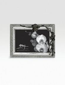 Inspired by the intricacies of natural forms, this graceful frame is richly detailed in cast metal with blackened floral accents. From the Black Orchid CollectionNickel-plate and blackened nickel-plateAccommodates a 4 X 6 photoOverall: 8 X 5¾Imported Inspired by the intricacies of natural forms, this graceful frame is richly detailed in cast metal with blackened floral accents. From the Black Orchid CollectionNickel-plate and blackened nickel-plateAccommodates a 4 X 6 photoOverall: 8 X 5¾Imported