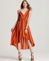 This Rebecca Minkoff silk dress takes a new-season high/low hem to stylish heights, designed with an asymmetric neckline and a vivid horizontal stripe for a slimming effect.