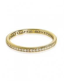 Finished in gold vermeil with delicate sparkles, Crislu's simple cubic zirconia ring is a stackable statement piece.