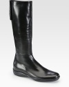 A signature logo detail and easy zip closure backs this traditional leather boot. Rubber heel, 1 (25mm)Shaft, 15Leg circumference, 13½Leather upperBack zip and velcro closureLeather liningRubber solePadded insoleMade in ItalyOUR FIT MODEL RECOMMENDS ordering one size up as this style runs small. 