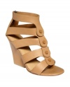 Layers of leather straps with just the right amount of lined contrast. L.A.M.B.'s Miranda wedge sandals are sexy with a walkable high heel.