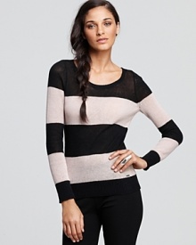 Relaxed sophistication starts with this GUESS sweater, boasting bold, graphic stripes.