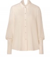 Super stylish off-white sheer bishop sleeve blouse from Theyskens Theory - With a sculptural drape and dramatic sleeves, this blouse will add of-the-moment appeal to your look - Button-up style with small collar and dramatic bishop-style sleeves -Style with leather-paneled leggings and platforms