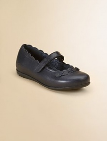 A comfortable Mary Jane with scalloped trim and bow details. Leather Grip-tape strap closure Padded arch Rubber sole Imported A comfortable Mary Jane with scalloped trim and bow details. Leather Grip-tape strap closure Padded arch Rubber sole Imported